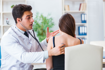 Doctor checking patient with stethoscope