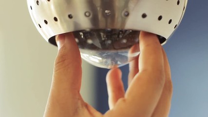 Hand Changing A Ceiling Light Bulb. Close-Up. 
