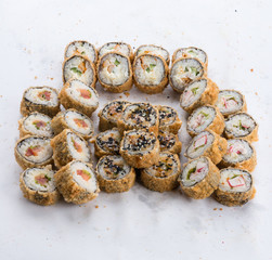 Sushi set and composition at white background. Japanese food restaurant, sushi maki gunkan roll plate or platter set.