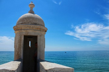 Watchtower of the fortress on the beach in Sesimbra village