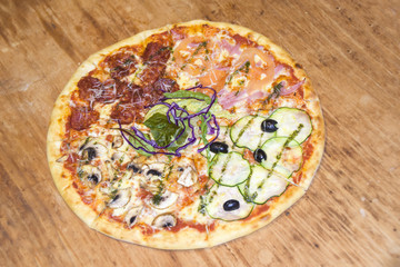 Four Seasons Pizza on a wooden background