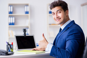 Young help desk operator working in office