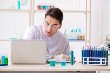 Male chemist working in lab