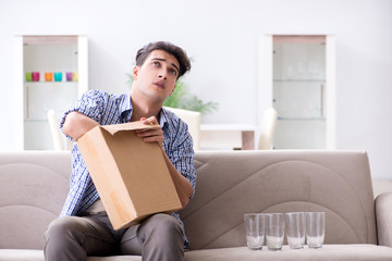 Man receiving wrong parcel with glasses