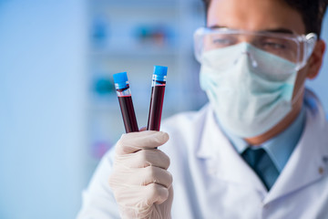 Lab assistant testing blood samples in hospital