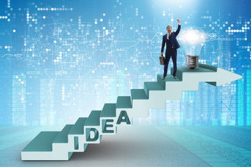 Concept of idea with businessman climbing steps stairs