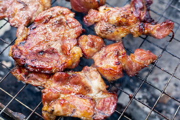 Grilled meat and steak on a grilled with smoke.