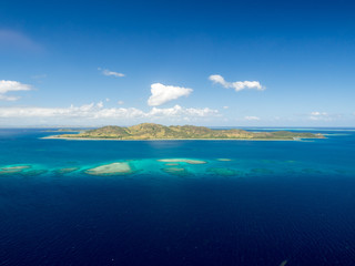 Aerial Landscape View of Tropical South Pacific Island Surrounded by White Sand Beach, Ocean and Reef in Fiji