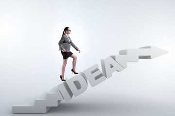 Concept of idea with businesswoman climbing steps stairs