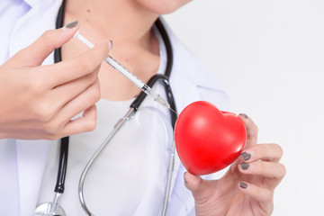 Doctor vaccination to the red heart. Isolated on white background. Studio lighting. Concept for healthy and medical