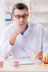 Dentist working teeth implant in medical lab