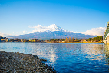 Fuji mountain outstanding along Kawaguchigo lake view with snow blue sky morning