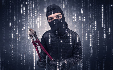 Burglar in action with encoded concept and his tools in his hand. 