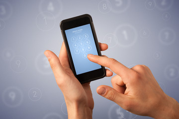 Female fingers touching smartphone with locked device requiring passcode