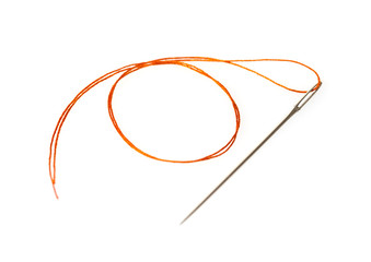orange thread in a needle