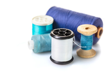 coils with colorful thread