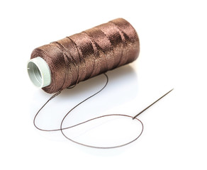 spool of brown threads