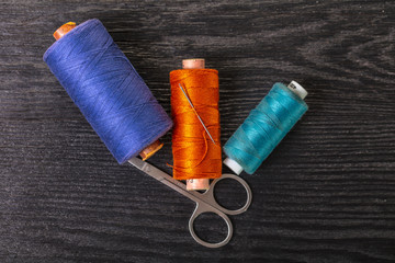 colored threads and scissors