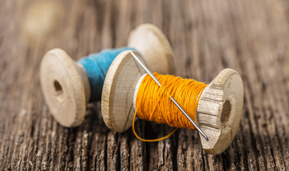 colored threads and needle