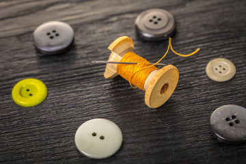 spool of threads and buttons