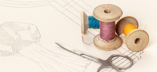 coils of colored threads and scissors