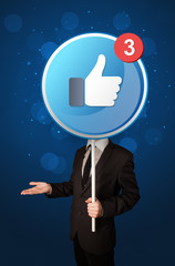 Smart businessman holding round sign with facebook like