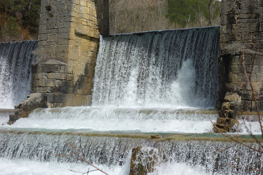 A waterfall weir in a non-urban scene day