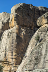 Rock climbers climbing El Indio, The Indian Peak, in Manzanares El Real, Madrid, Spain.