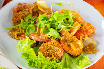 Shrimp grilled fried with curry powder.