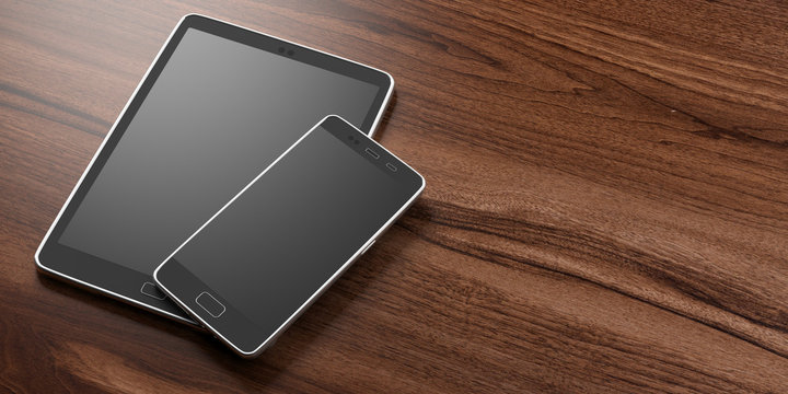 Smartphone and tablet with blank black screens on wooden background, copy space. 3d illustration