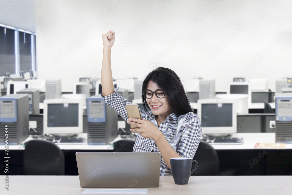 Canvas Prints Female worker celebrating her success