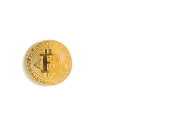 Golden bitcoin isolated on white background.