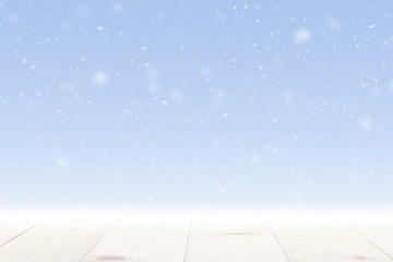 snow falling and wooden table winter season background