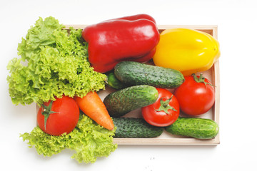 Fresh Summer Vegetables in Wooden Box Isolated. Organic Vegetables Vegetarian Vegan Health food Eatting