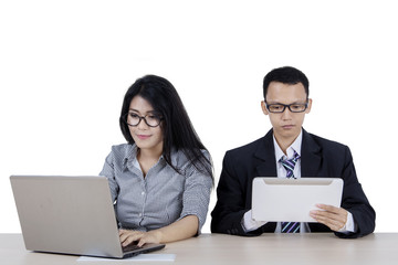 Two business people working together in the studio