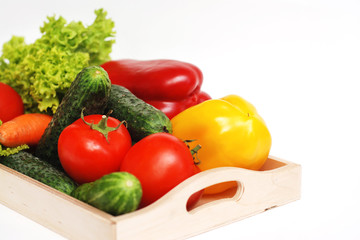 Fresh Summer Vegetables in Wooden Box Isolated. Organic Vegetables Vegetarian Vegan Health food Eatting