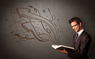 Casual young man holding book with brown arrows and stars flying out of it