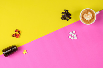 top view concept pill supplemeants coffee bean capuchino on yellow pig background