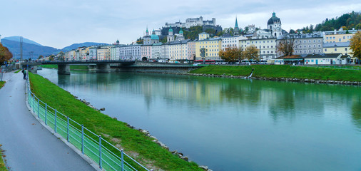 View of Salzach river embankment and Hohensalzburg Castle, Salzburg, Austria