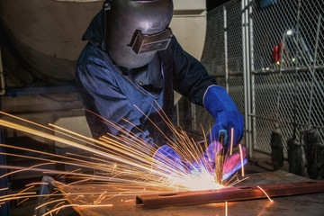 Industrial worker is repair metal part