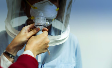 Closeup for hand use the Respiratory Fit Test Kit for Replacement Nebulizer in laboratory at hospital, soft and select focus.