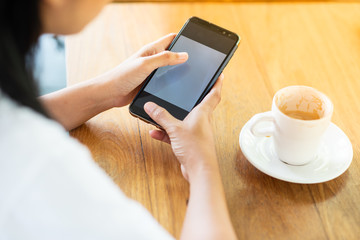 Play the mobile phone and drinking coffee in the morning.