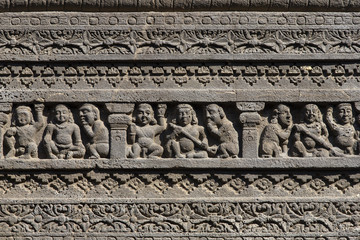 Rock carvings texture background of Ellora Caves in Aurangabad, India . A UNESCO world heritage site in Maharashtra, India