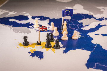 Chess pieces over an european map. Brexit concept