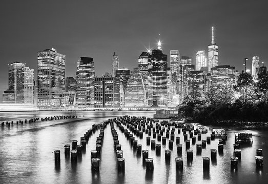 Black and white picture of the New York City at night, USA.