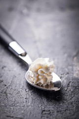 Whipped cream on a spoon
