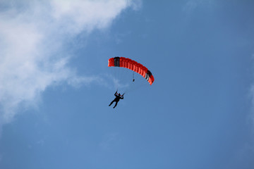 The paratrooper descends to the ground