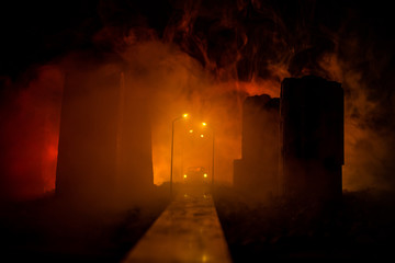 Empty street of burnt up city, flames on the ground and blasts with smoke in the distance....