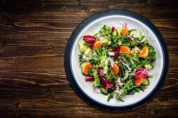 Vegetable salad on wooden background