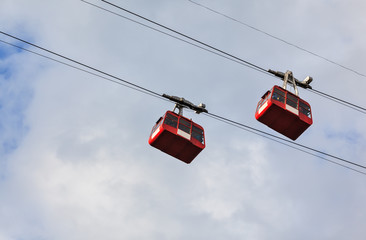 The two red cabin of the ropeway in the capital of the Indian state of Sikkim - Gangtok.